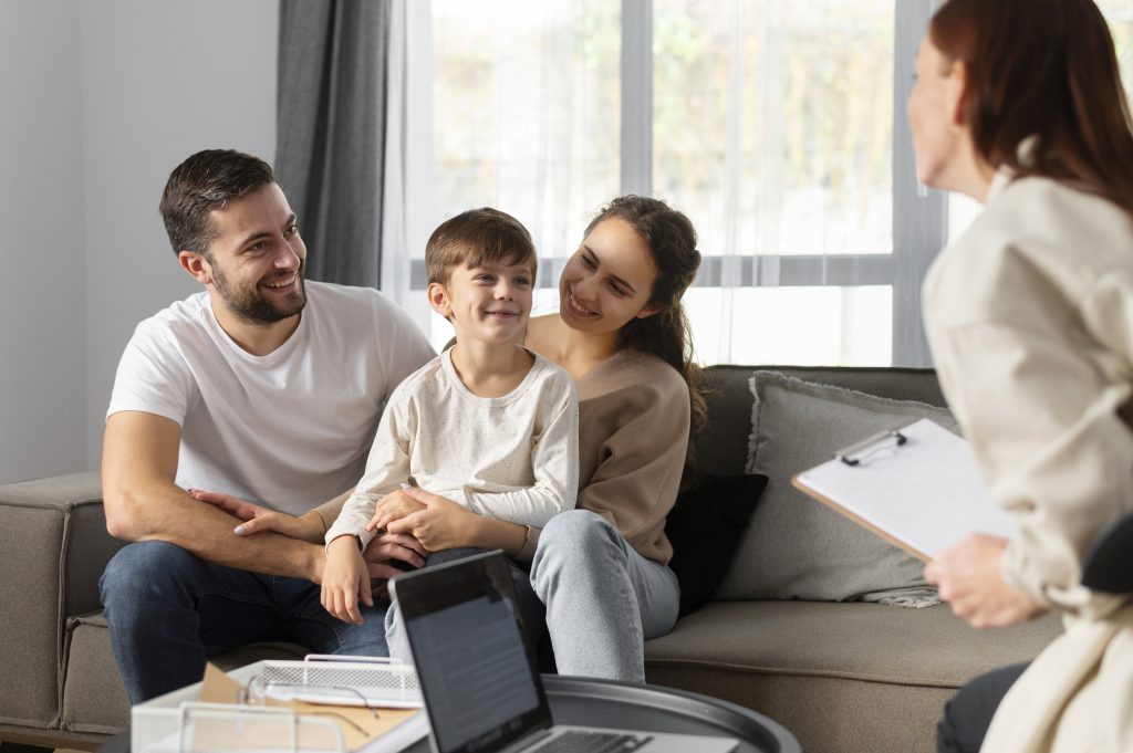close-up-family-discussing-with-therapist