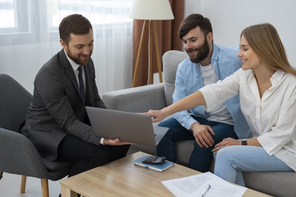 male-real-estate-agent-doing-business-showing-house-potential-buying-couple