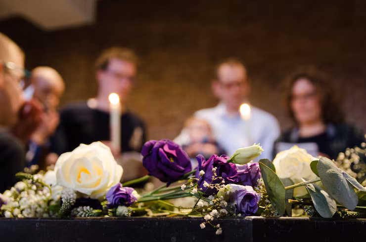 people-with-lit-candles-church